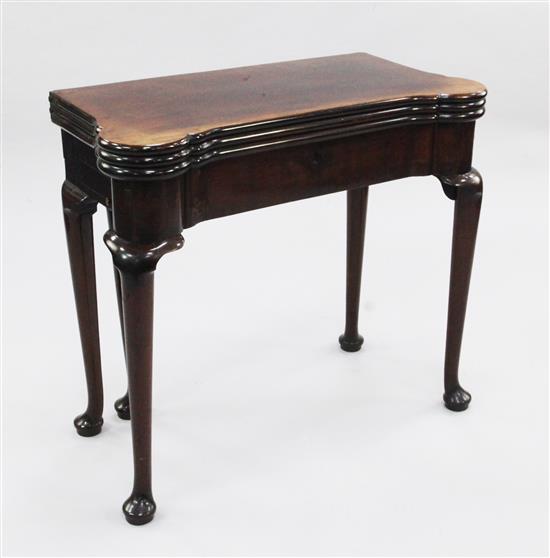 A George II mahogany combined tea, card and games table, H.2ft 6in. W.2ft 7in. D.1ft 4in.